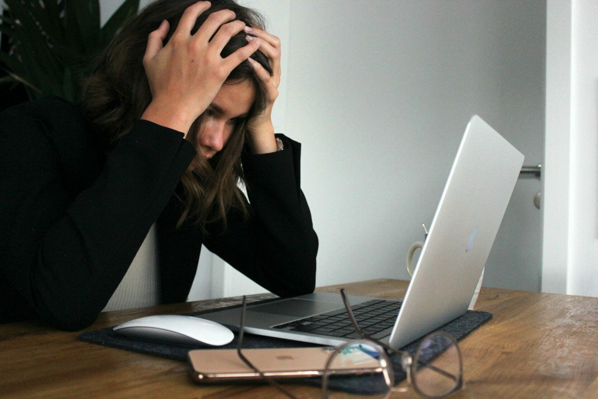 Frustrated person in front of a computer - Addressing Burn Out Head On