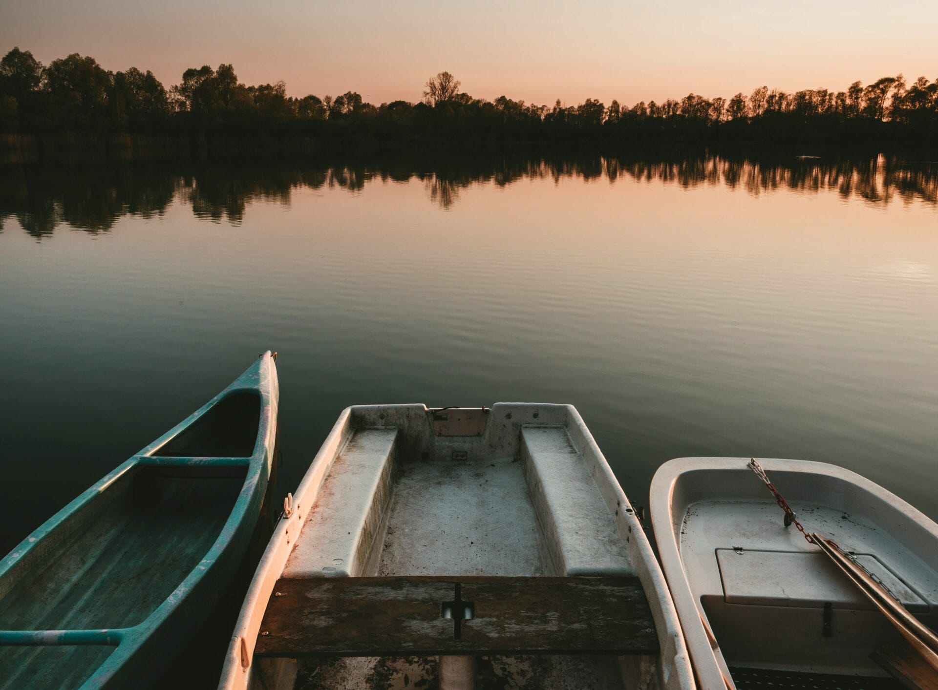 boats in the harbor at sunrise