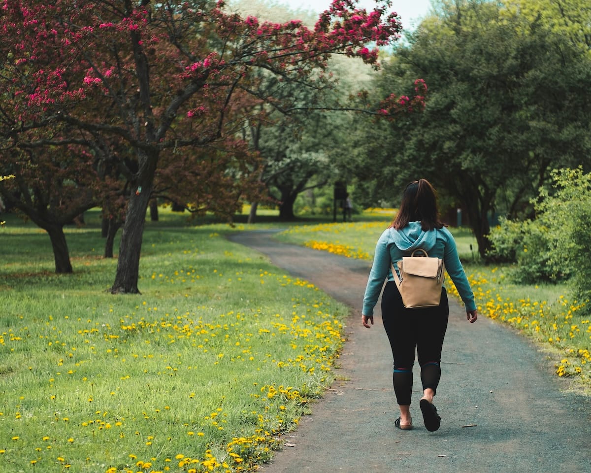 Woman walking through the woods