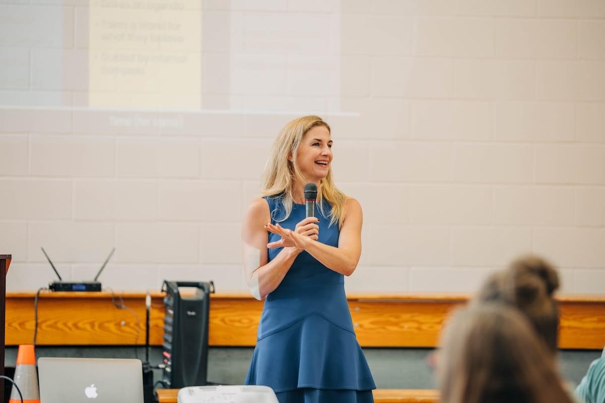 Angie Witkowski speaking at an event on stage